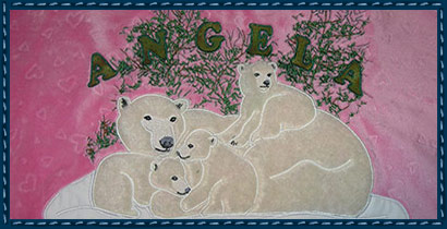 After Digitizing: Father asked for a throw for her bed.  The polar bears were appliqued with faux fur and her name added for the finishing touch.